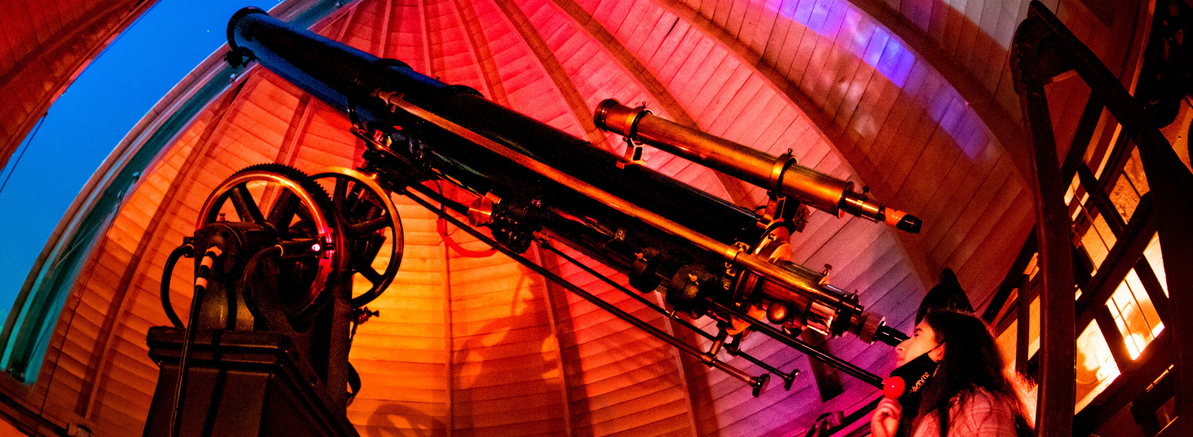 A student views a partial lunar eclipse at through the 12-inch telescope the University of Illinois Observatory.