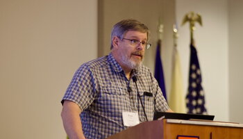 A man speaking at a podium.
