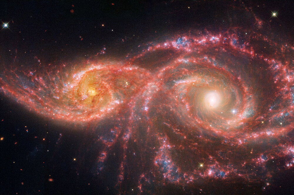Two galaxies next to each other.