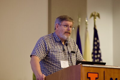 Paul Ricker speaking at a podium.