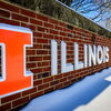 Illinois and the block I on a brick wall in the snow.