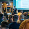 A group of people listening to a presentation.