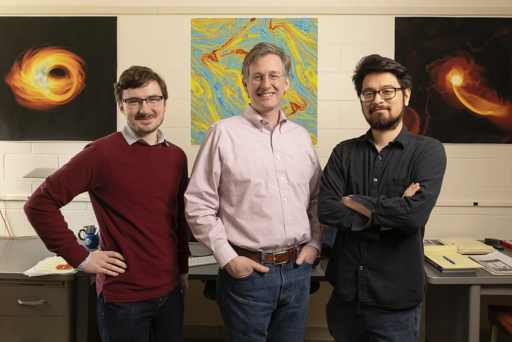Professor Charles Gammie and graduate students Ben Prather and Charles Wong. Professor Charles Gammie, center, and graduate students Ben Prather, left, and Charles Wong, right.