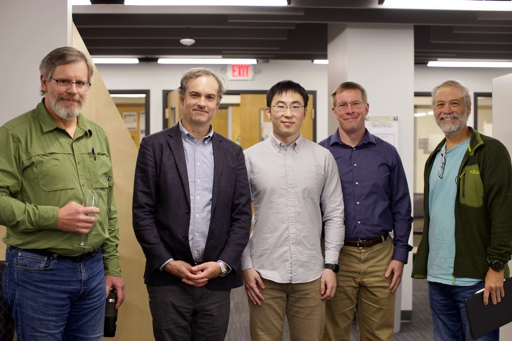 Five men standing and posing for a picture. Paul Ricker, Joaquin Viera, Jianyang (Frank) Fu, Jeffrey Fillipini, Leslie Looney.