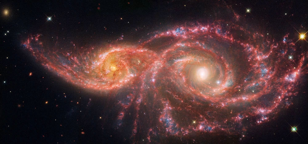 Two galaxies next to each other.