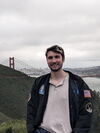 Grant Merz standing in front of the Golden Gate Bridge in San Francisco